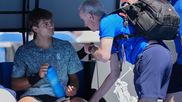 Flavio Cobolli of Italy receives treatment during his first round match against Arthur Fery. Pic: AP