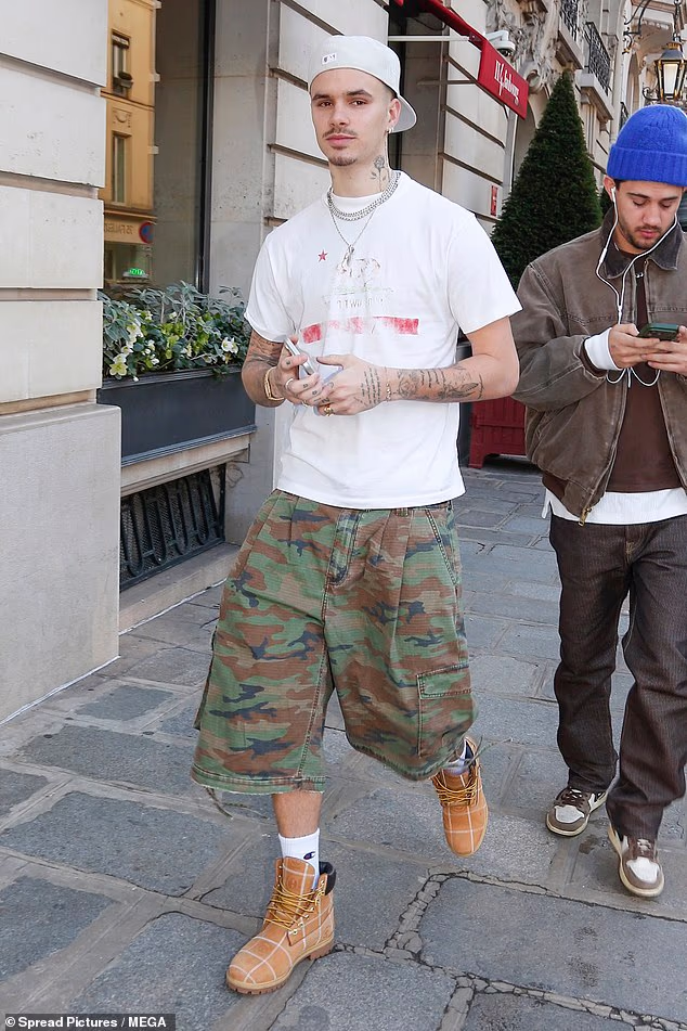 Meanwhile Romeo Beckham was spotted in Paris on the same day as his parents' comments on the throwback post
