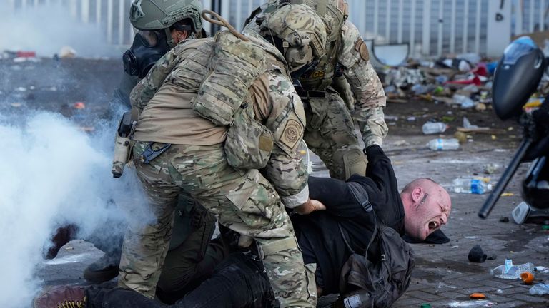 Agents detain a man during a protest in June in Portland. Pic: AP