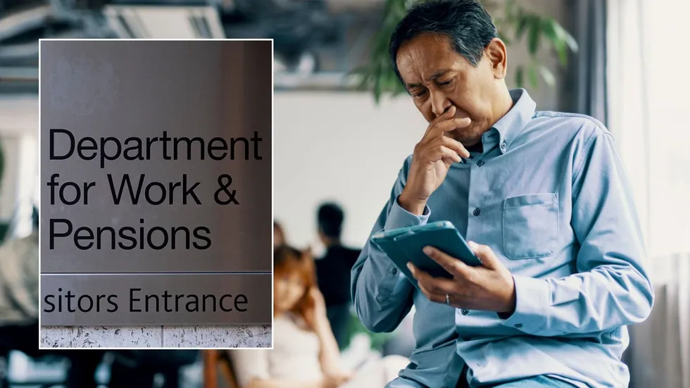 Older man looking sat tablet and DWP sign