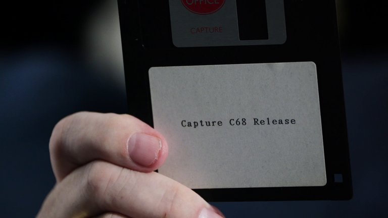 Mr Marston shows a disc with the faulty computer software called Capture