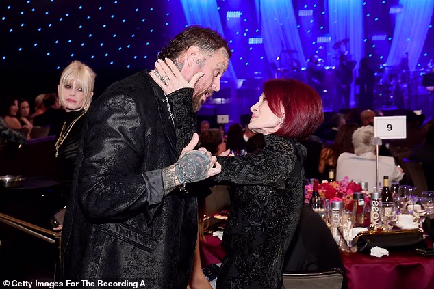 Later in the evening, former X Factor judge Sharon looked thrilled to chat to Jelly Roll, whose real name is Jason DeFord, as she held his face in her hands