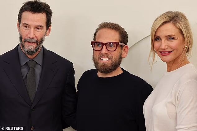 Reeves, 61, cut a classic figure in a sharp black suit with his greying beard on display, while Diaz, 53, looked every inch a movie star in a sleek white dress