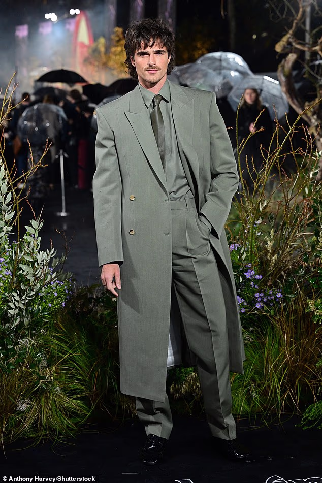 Joining his co-star for the premiere, Jacob opted for a dapper dark green suit as he posed for snaps
