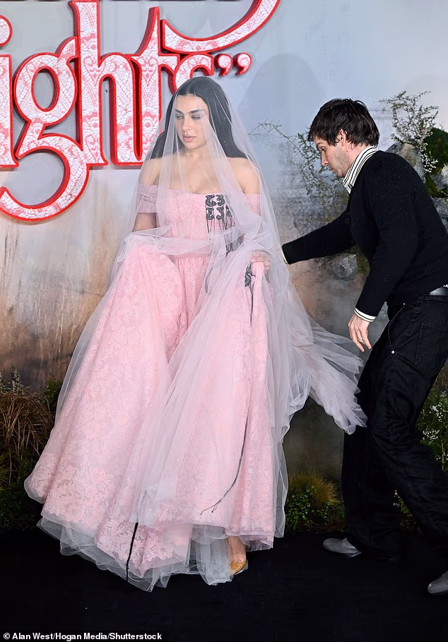 Channelling the passionate heroine Catherine Earnshaw, Charlie arrived in a dusky pink gown with a matching bridal veil