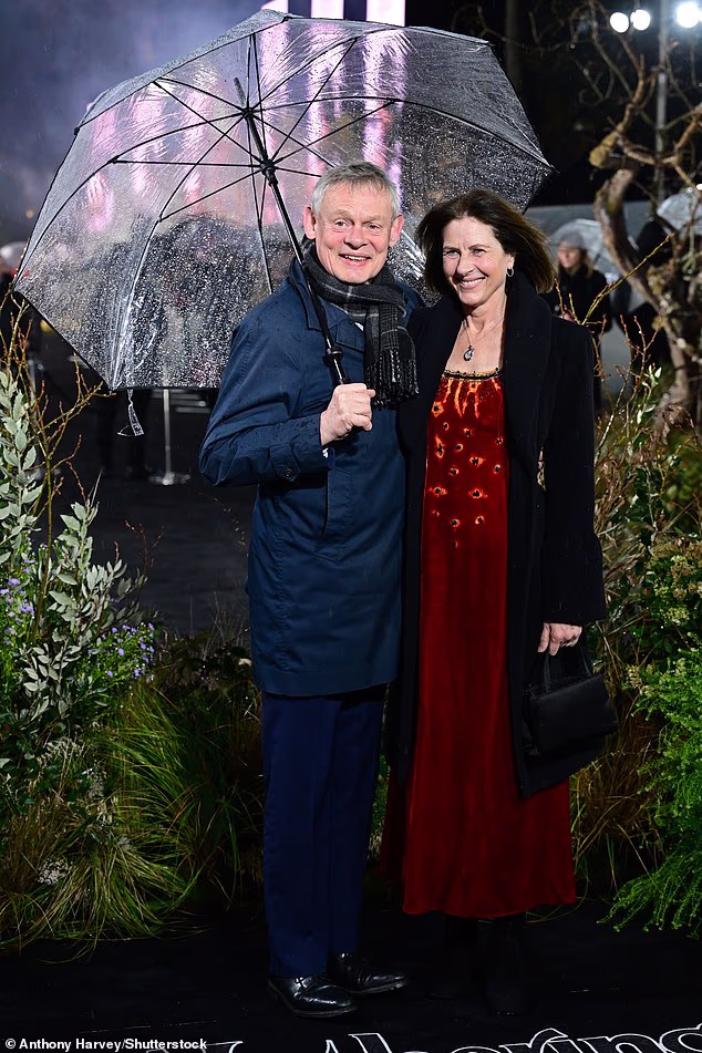 Martin Clunes were joined by his wife Philippa Braithwaite as they arrived for the rain-soaked premiere together