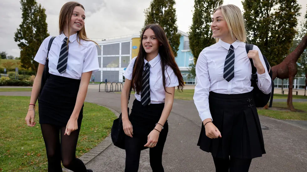 Secondary school girls walking to school