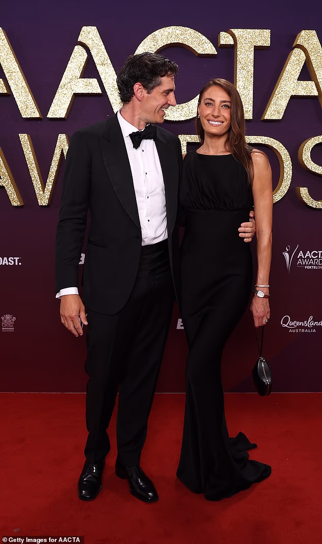 The pair happily cuddled up to each other on the red carpet