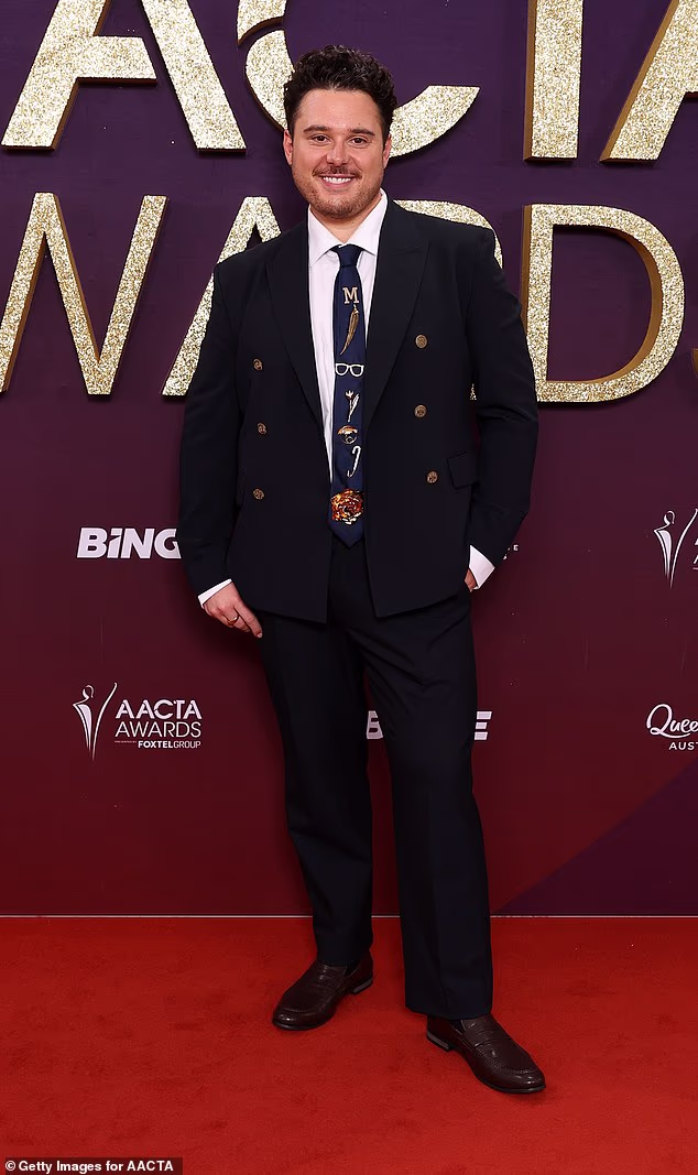 Radio star Mitch Churi, 30, stepped out in a classic black suit