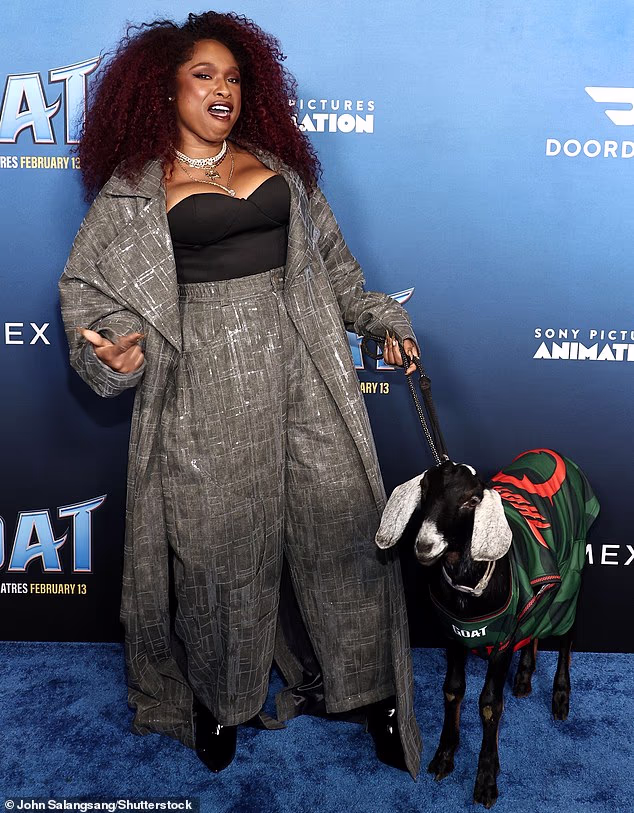 Jennifer Hudson had a blast while donning a pair of high-waisted, gray pants as well as a fitted black top and long gray coat