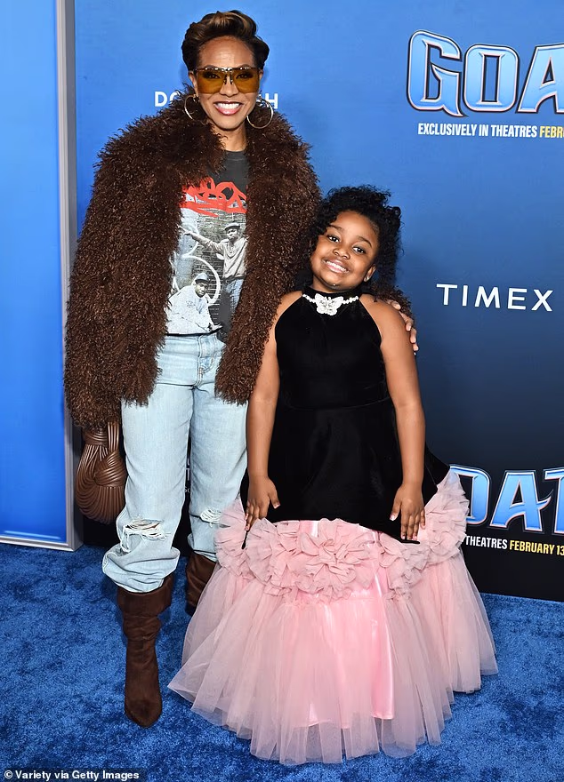 Singer MC Lyte showed off her personal sense of style in a pair of light blue jeans as well as a printed shirt alongside viral child rapper Savannah 'Van Van' McConneaughey
