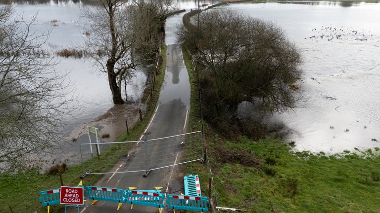 Flood water cover a road near to Harbridge in Hampshire. Pic: PA