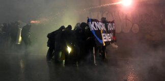 Winter Olympics struck by mass protests in Milan as fireworks and flares fly in dramatic scenes