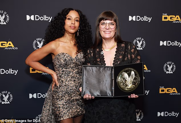 She later held a smile on her face with her medallion award backstage alongside actress Kerry Washington