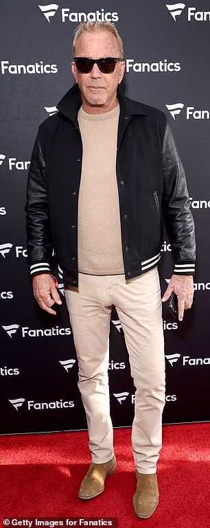 He also sported a beige sweater, clingy beige jeans and brown suede boots at the Fanatics bash