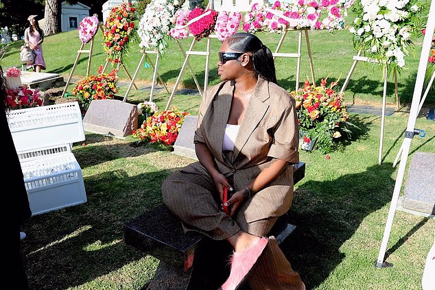 Among the images included a shot of Cori sitting peacefully at her child's gravesite