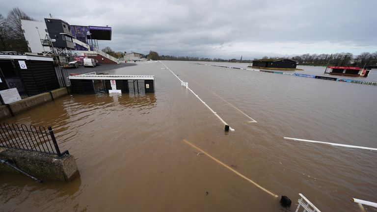 Flood water covers the course at in Worcester racecourse. Pic: PA