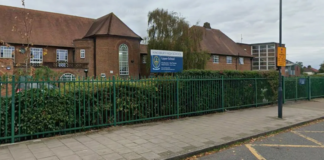 Two pupils rushed to hospital after stabbing at London secondary school as police launch hunt for teenage suspect