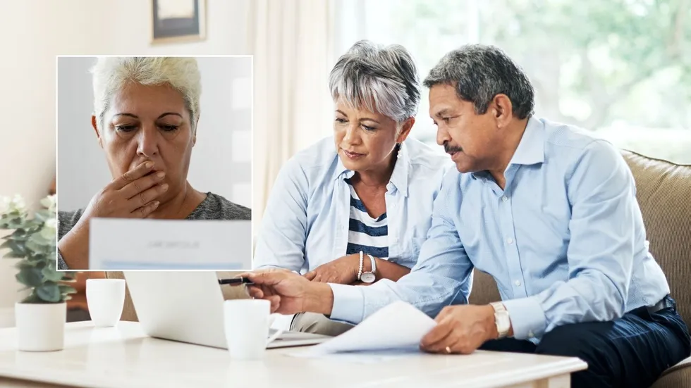 Pension warning - couple shocked at laptop