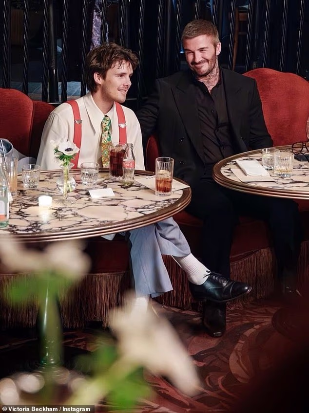 Cruz made quite the fashion statement in a cool oversized blue suit which he teamed with a yellow patterned tie and red braces (seen with dad David)