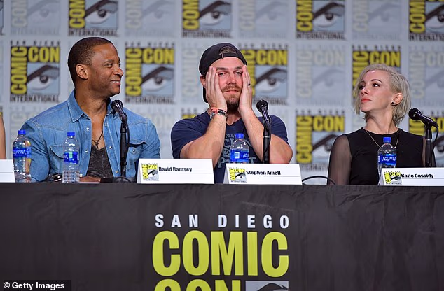 Ramsey recalled noticing how many children were receiving chemotherapy when he would go in for his treatments. He said the experience made him more grateful about the acting roles he won; pictured in 2019 in San Diego with Amell and Katie Cassidy