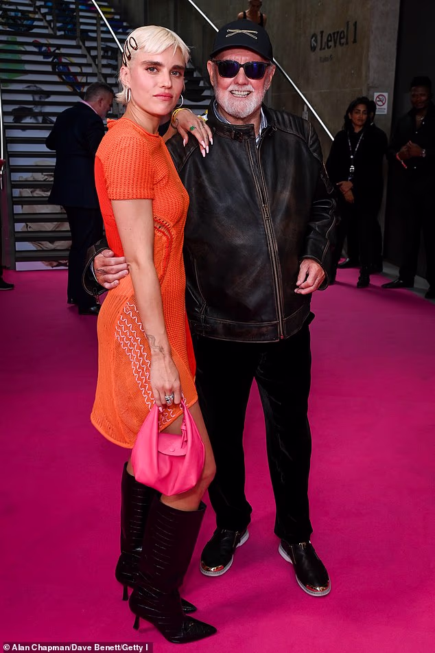 The model is the daughter of Queen drummer Roger Taylor (pictured together in 2025) and former actress Debbie Leng
