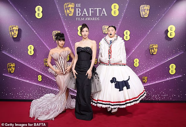 Rei Ami, EJAE and Audrey Nuna of KPop Demon Hunters attend the EE BAFTA Film Awards