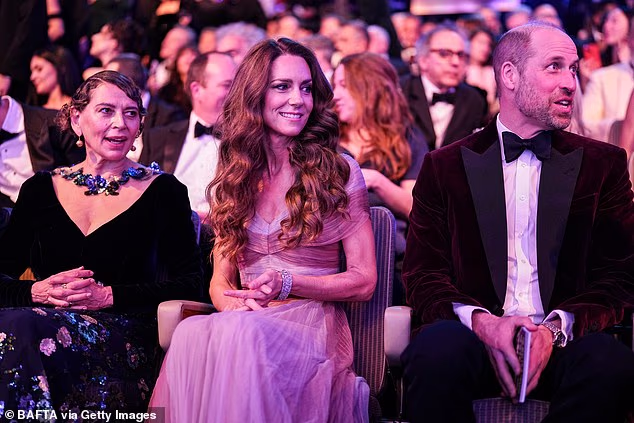 Dame Donna sat next to the Duke and Duchess of Cambridge at the event