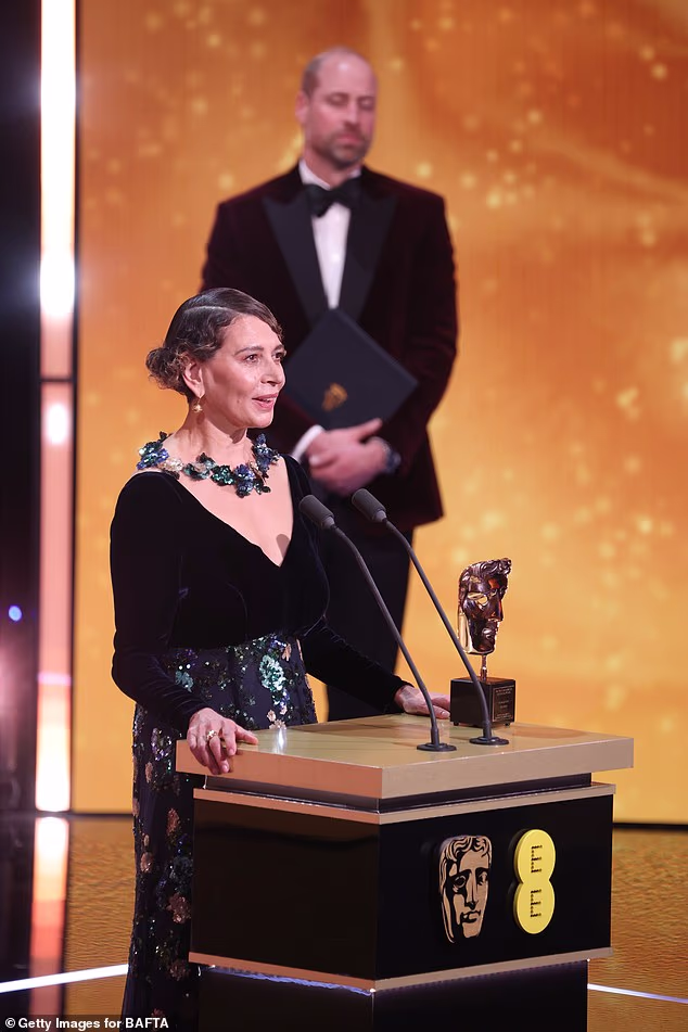 Dame Donna Langley accepts the BAFTA Fellowship award from Prince William