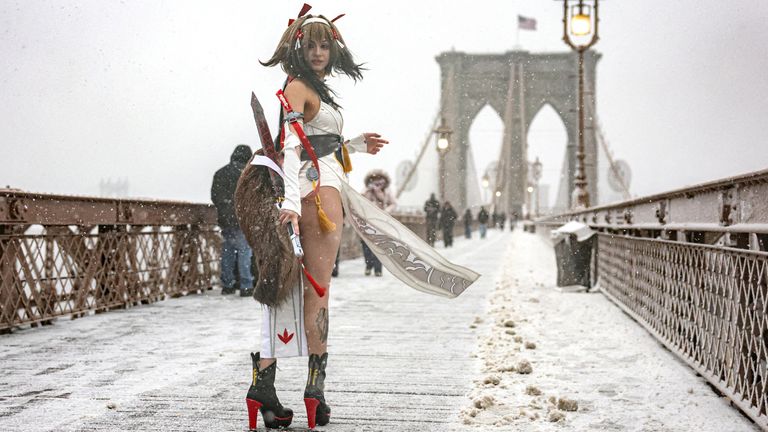 A model poses on the Brooklyn Bridge. Pic: Reuters