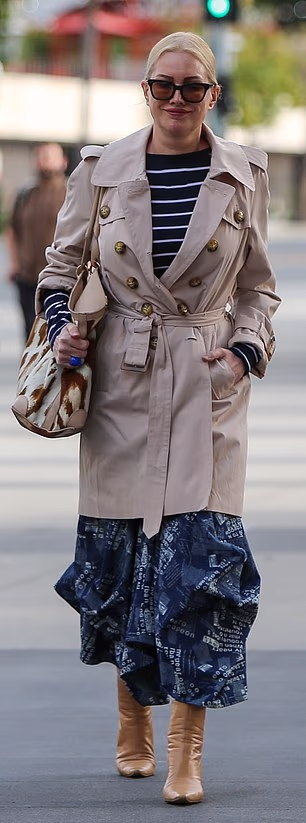 Alice Evans smiled as she turned up for Monday's hearing