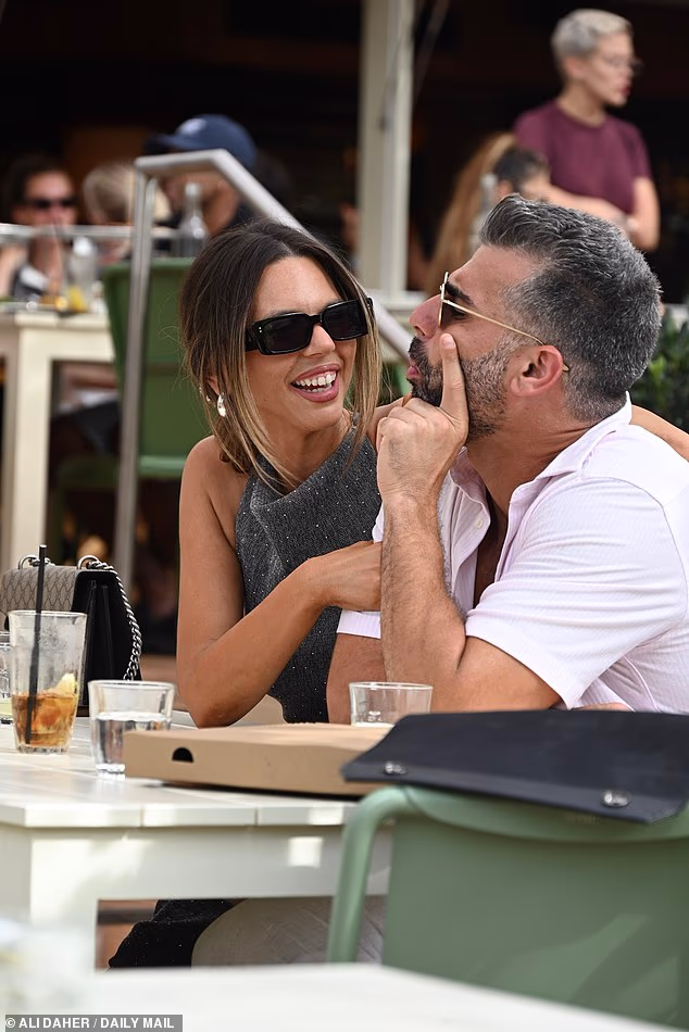 The account manager was all smiles as she got cosy with intruder groom Joel Moses, 31, during lunch at Club Rose Bay with friends
