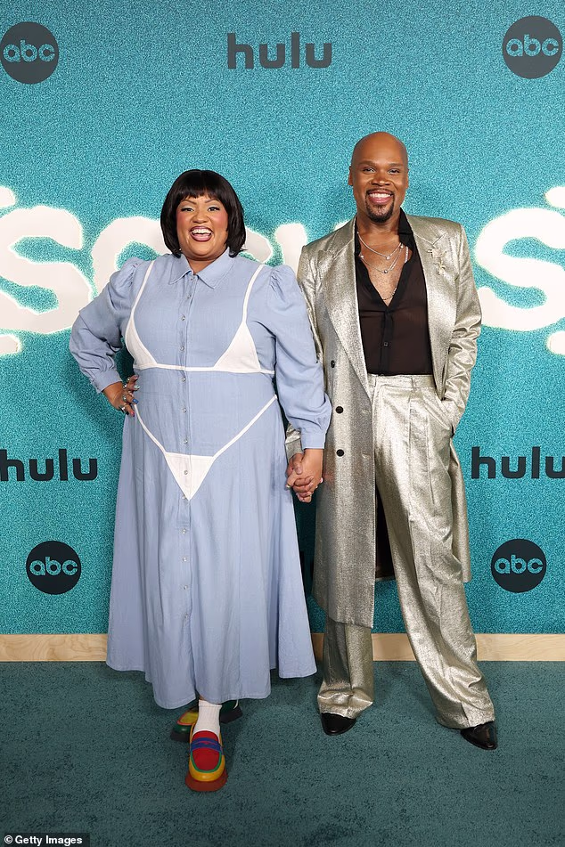 Comedian X Mayo and Michael James Scott, who have joined the cast of the Scrubs revival as recurring guest stars, held hands on the red carpet