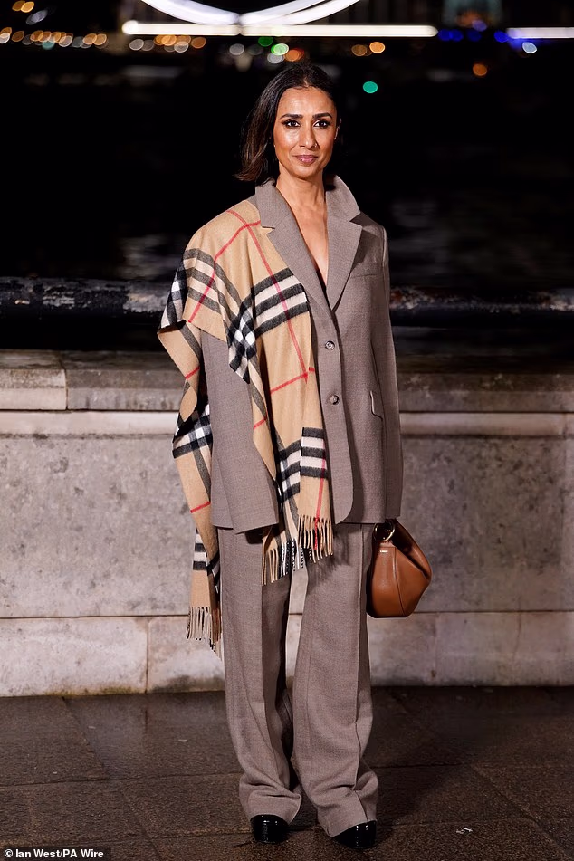 Anita Rani shrugged the iconic Burberry scarf over her shoulder