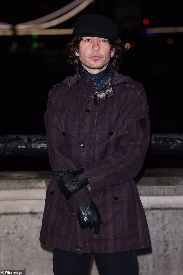Barry Keoghan rocked a purple coat and leather gloves