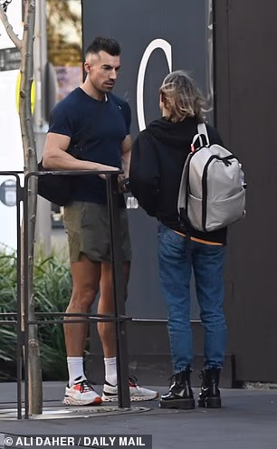 Filip, who is paired with Stella Mickunaite, leaned in close as the pair shared an emotional moment in Sydney's Green Square during a filming break