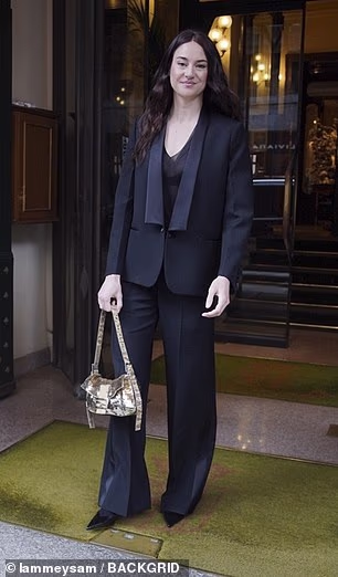 Shailene Woodley looked stylish as she left her hotel in a black sheer low cut top which she wore with a matching blazer and trousers