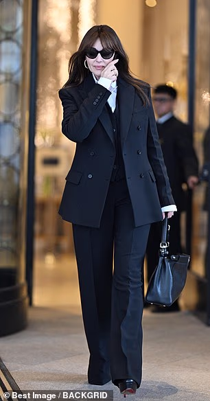 Monica Bellucci sported a three-piece black suit