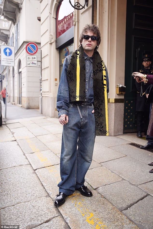 Lennon Gallagher opted for a laid back look in a dark denim shirt and matching jeans as he arrived to the Fendi show