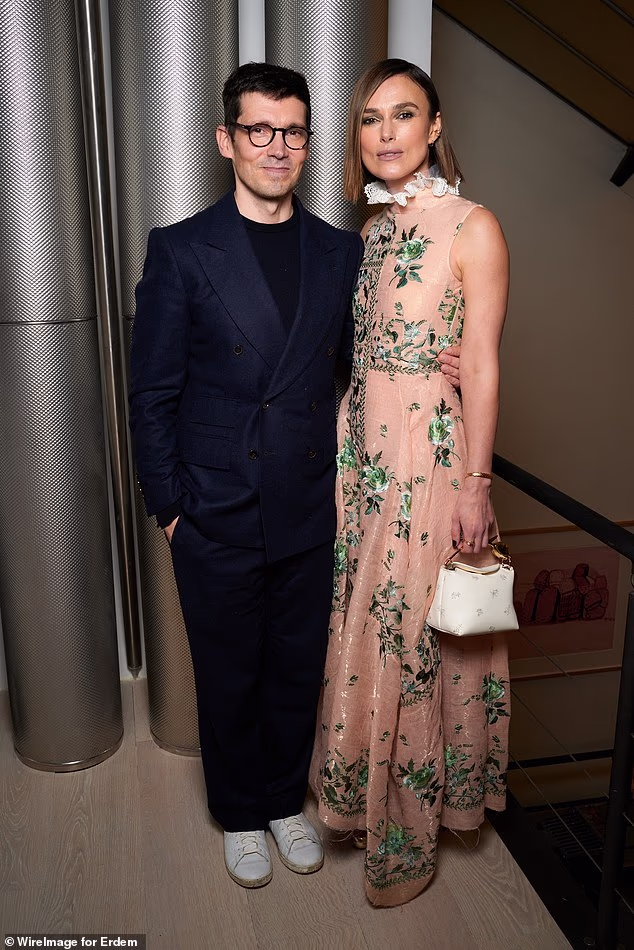The chic gown featured a high frilly lace neckline, a sleeveless design, a fitted bodice, and an intricate green floral embroidery (pictured with founder Erdem Moralioglu)