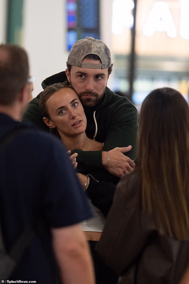 Millie, 29, and Zac, 26, who came in second place in the final, put on a cosy display as they arrived at the airport