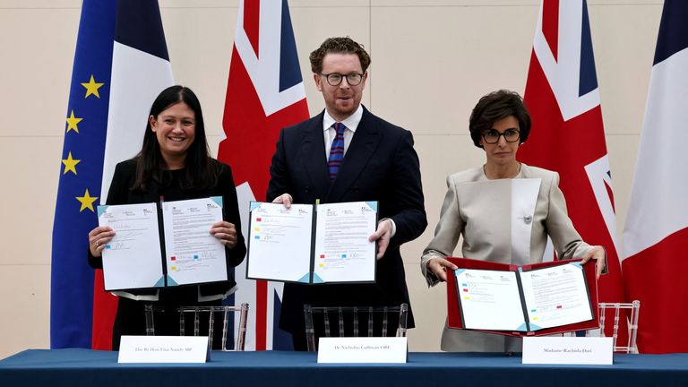 Culture Secretary Lisa Nandy, British Museum director Nicholas Cullinan and France's culture minister Rachida Dati show the loan agreement in July 2025. Pic: Reuters