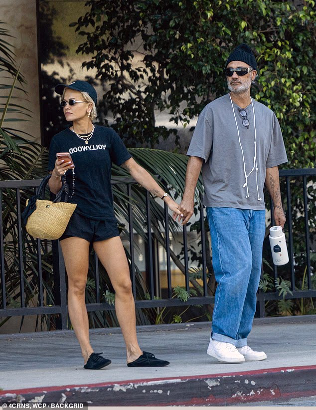 The songstress, 35, put on a leggy display for the low-key outing in a pair of skimpy shorts which she teamed with an oversized Hollywood T-shirt