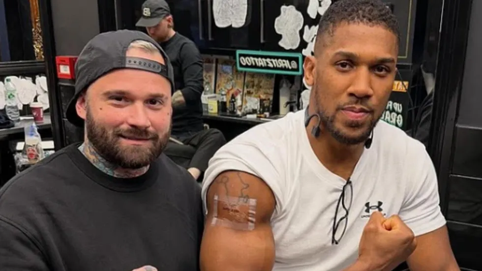 Anthony Joshua has honoured two close friends who lost their lives in a devastating road accident by permanently inking their names onto his arm