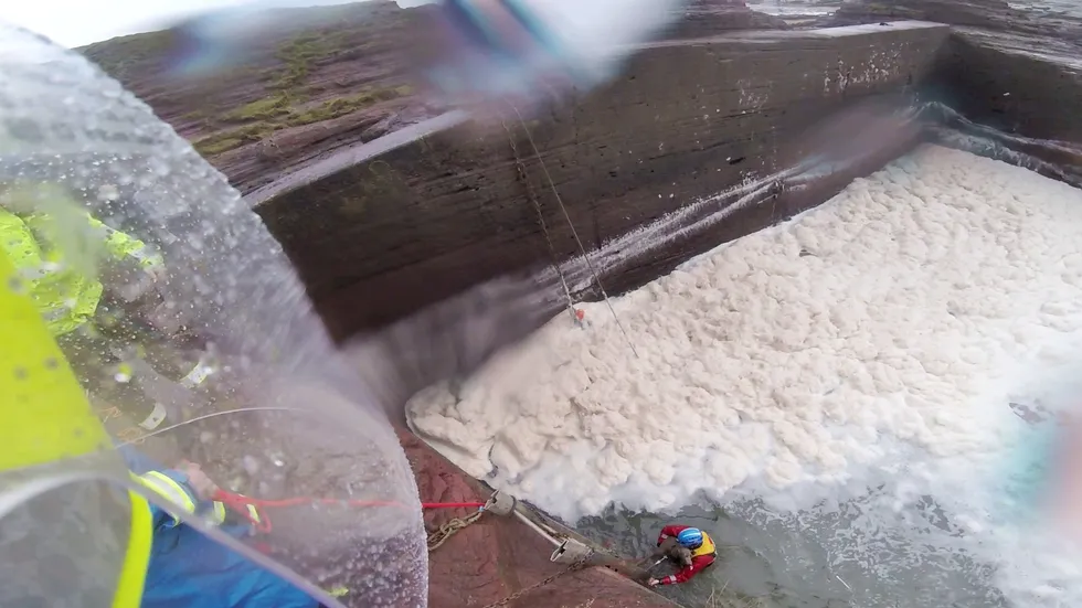 The crew working in the wet conditions\u200b