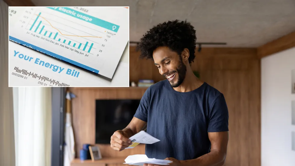 Happy person looking at energy bill
