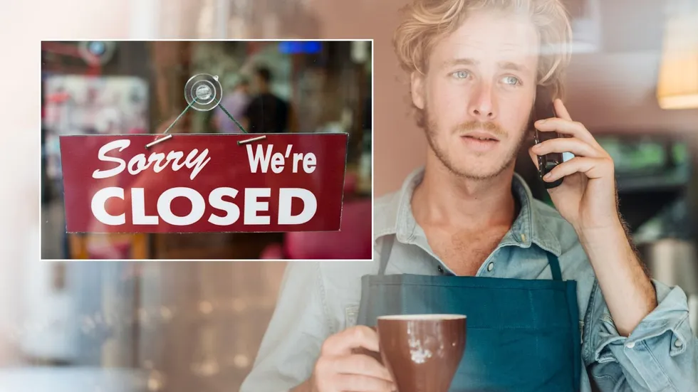 Man on phone and closed sign
