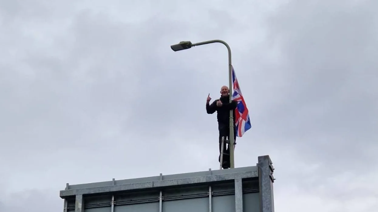 Man up lamp post next to Union Jack