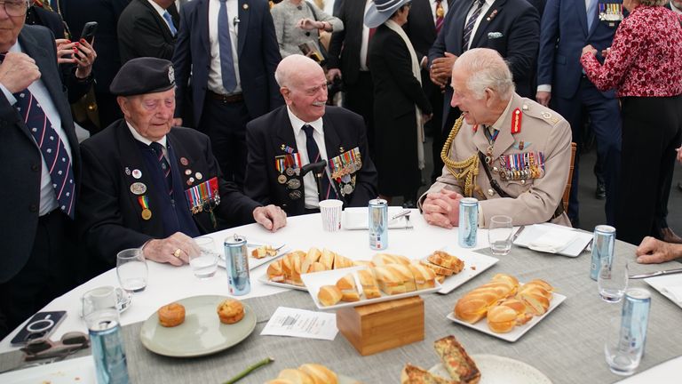 King Charles speaks with D-Day veterans Arnie Salter (centre) and Stan Ford (left) in 2024. File pic: PA