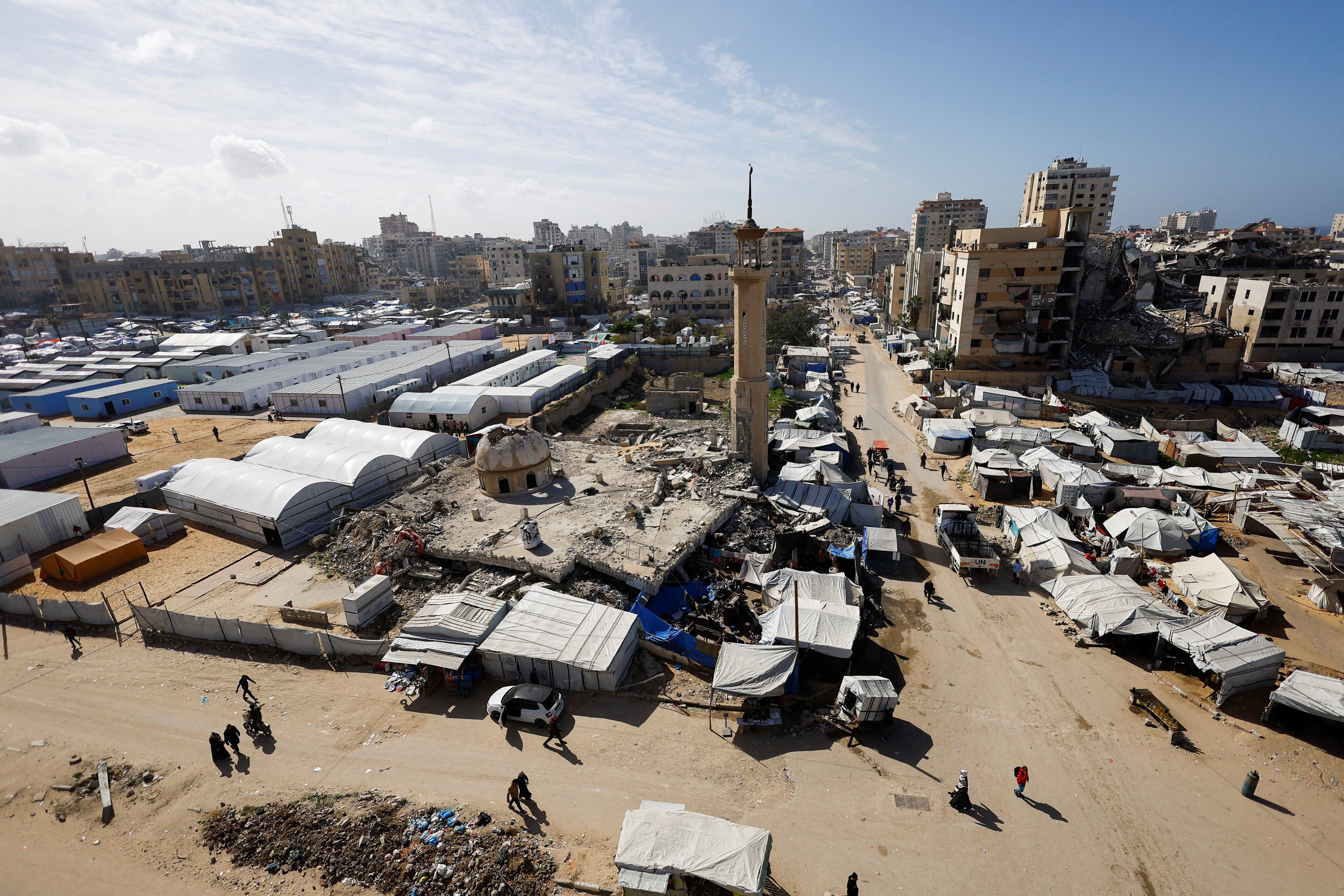 A mosque, destroyed during the two-year Israeli offensives, is surrounded by tents for displaced Palestinians, in Gaza City, February 11, 2026. Photo: Reuters